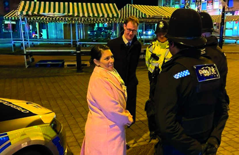 Tom Randall MP and the Home Secretary in Arnold Market chatting with Police Officers from Gedling’s Neighbourhood Policing teams on Friday 28 January 2022